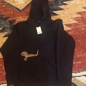 Coach Black Hoodie with Tan Dinosaur Detail